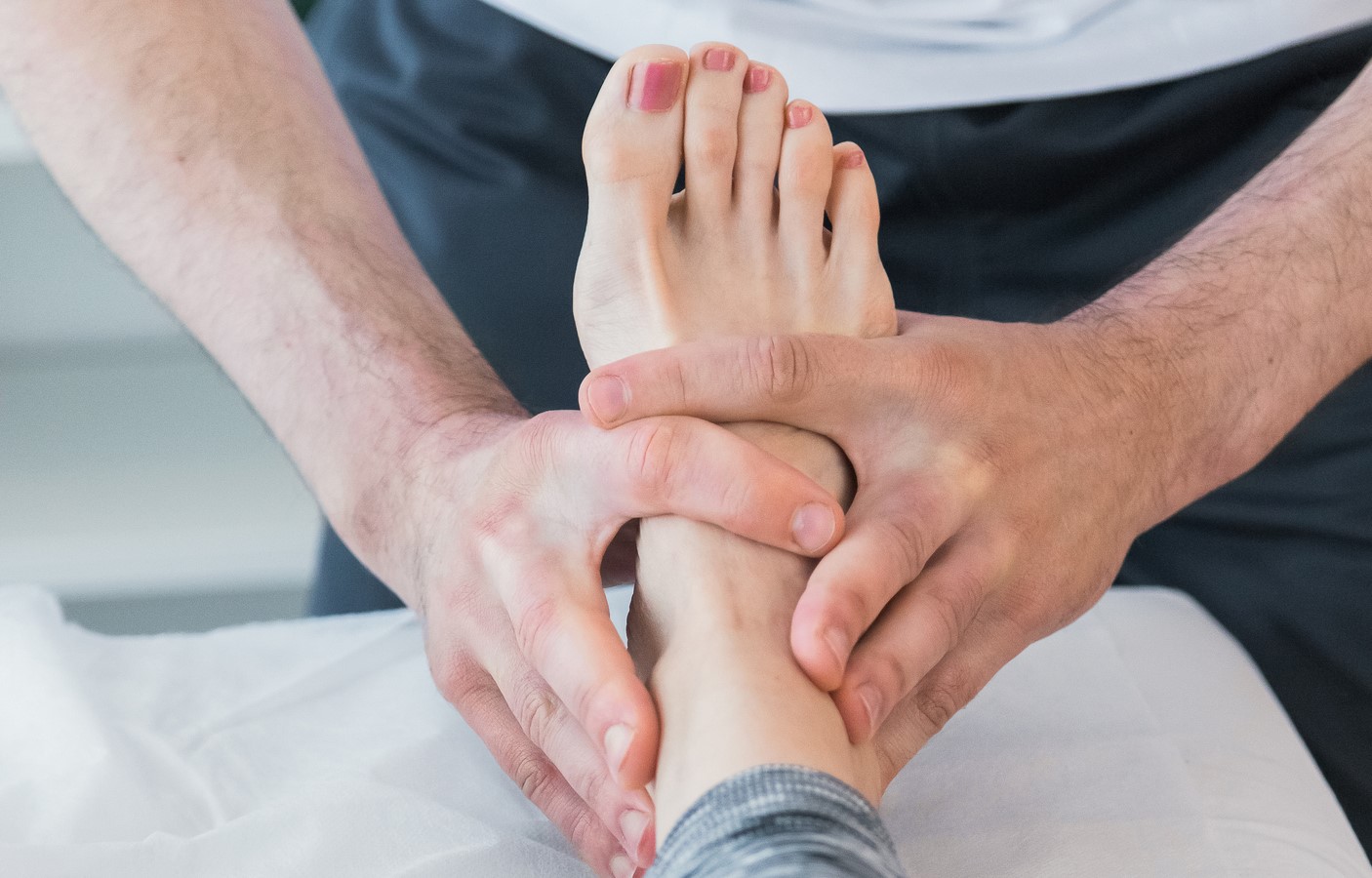 Image of therapist examining the foot 
